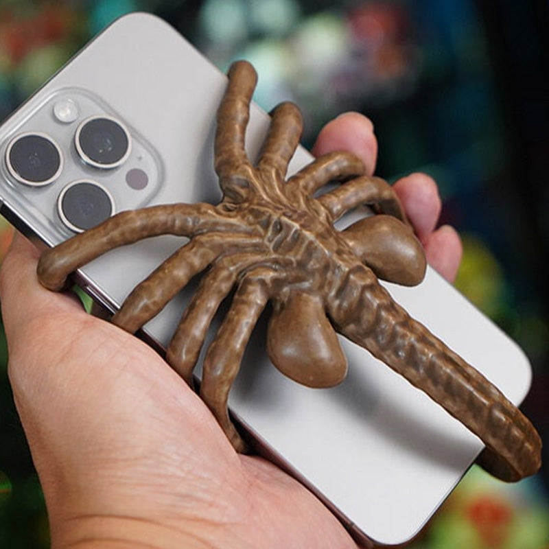 Verschrikkelijke Facehugger-telefoonhouder