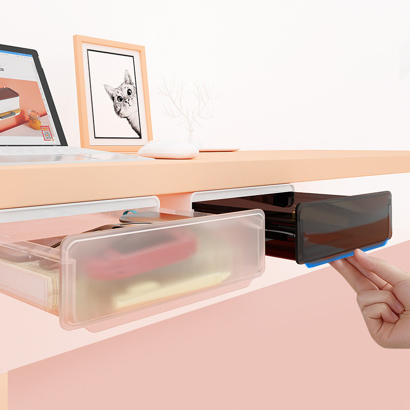 Sous le tiroir du bureau