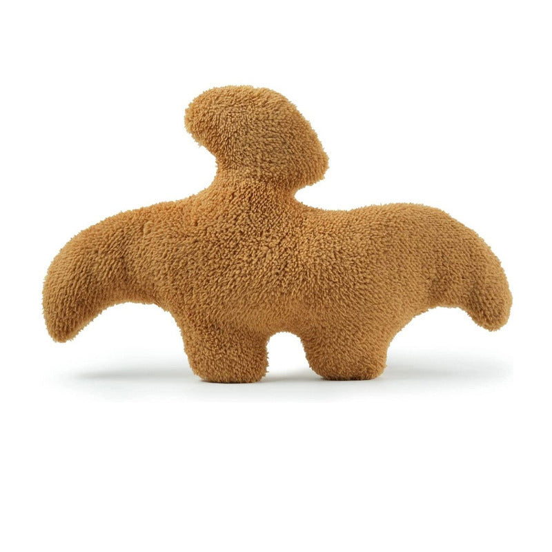 Coussin en peluche dinosaure
