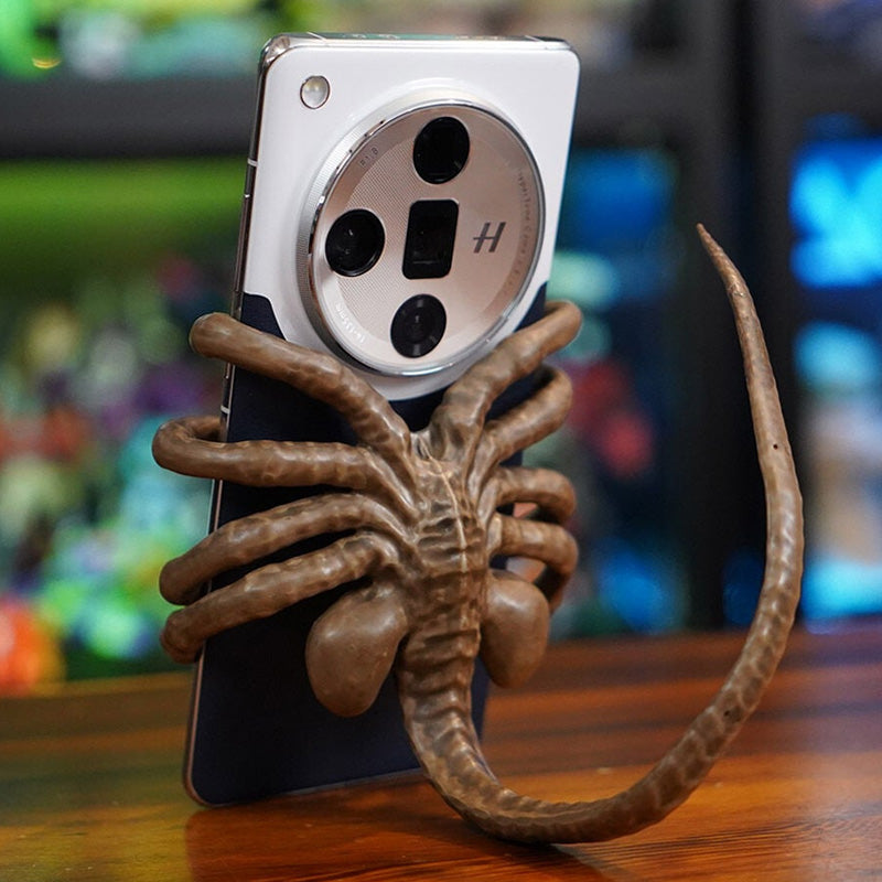 Verschrikkelijke Facehugger-telefoonhouder