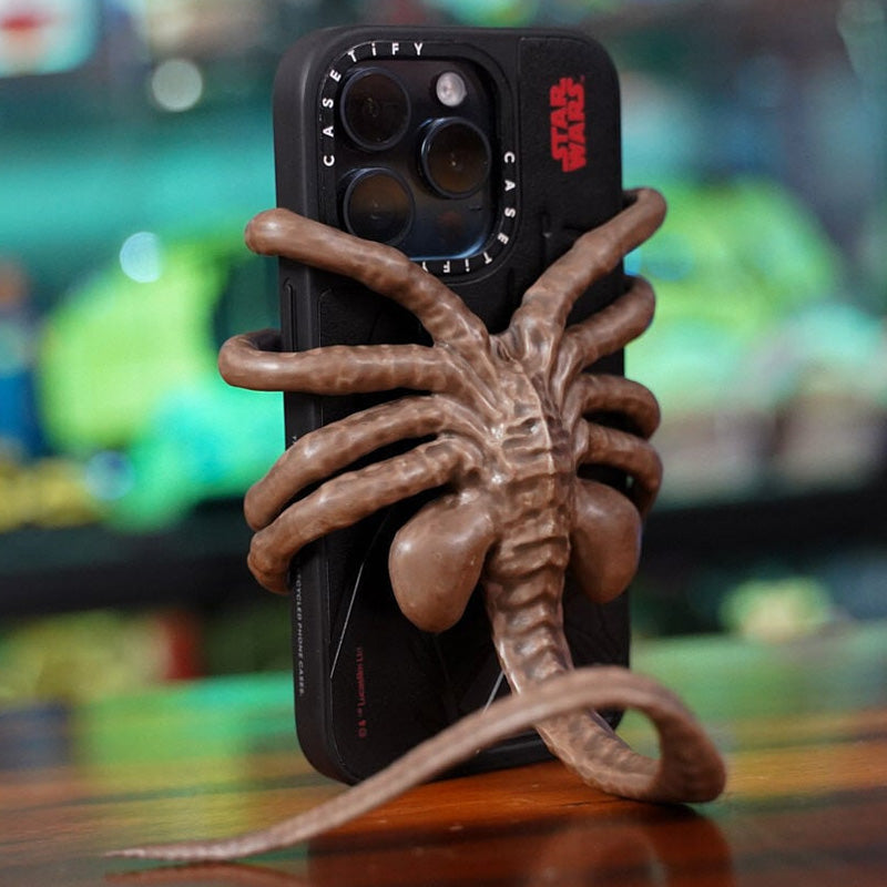 Verschrikkelijke Facehugger-telefoonhouder