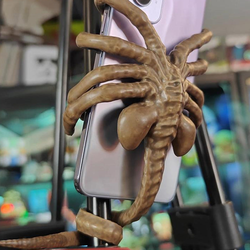 Verschrikkelijke Facehugger-telefoonhouder