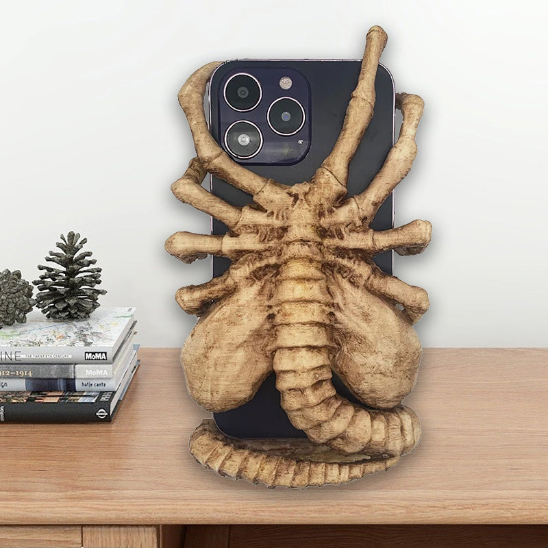 Verschrikkelijke Facehugger-telefoonhouder