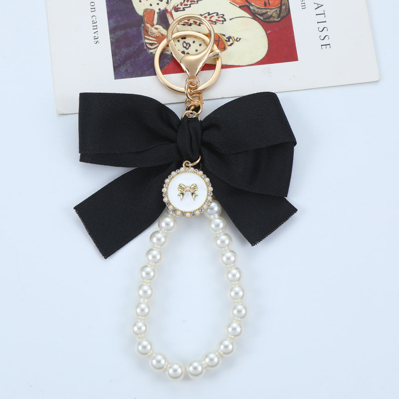 Porte-clés avec bracelet décoré de fausses perles
