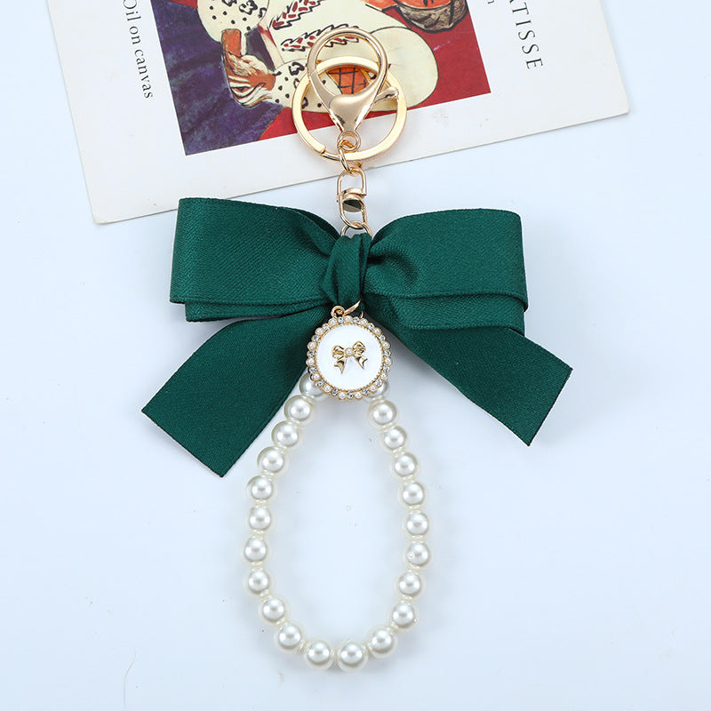 Porte-clés avec bracelet décoré de fausses perles